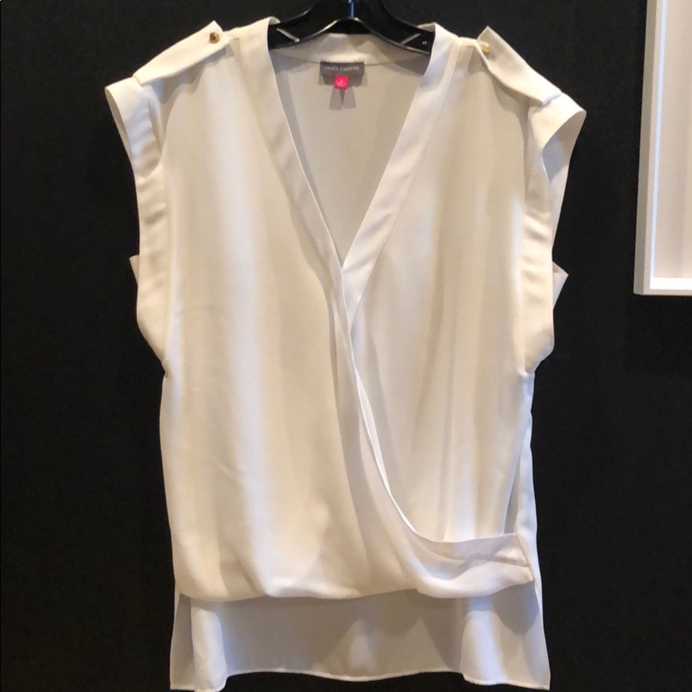 High low white top with brass detail.